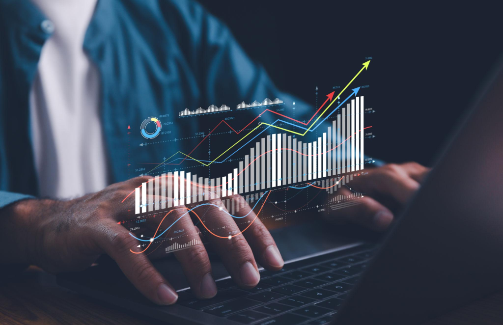 Analyst working on business analytics dashboard with KPI, charts and metrics to analyze data and create insight reports for executives and strategical decisions. Corporate strategy for finance.