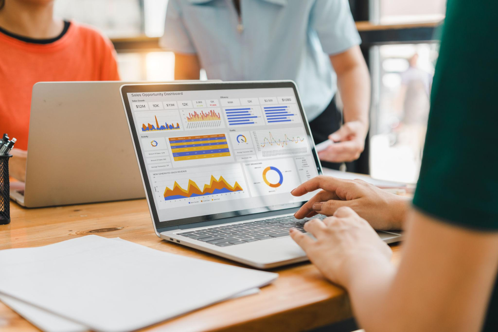Person interacts with a digital sales dashboard displaying various performance metrics and analytics in AI WordPress plugins money automation